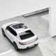 A photo of a white Polestar 2 EV on a driveway.